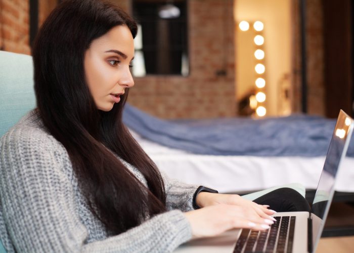 Cute woman stay at home and working at laptop Cute woman stay at home and working at laptop.